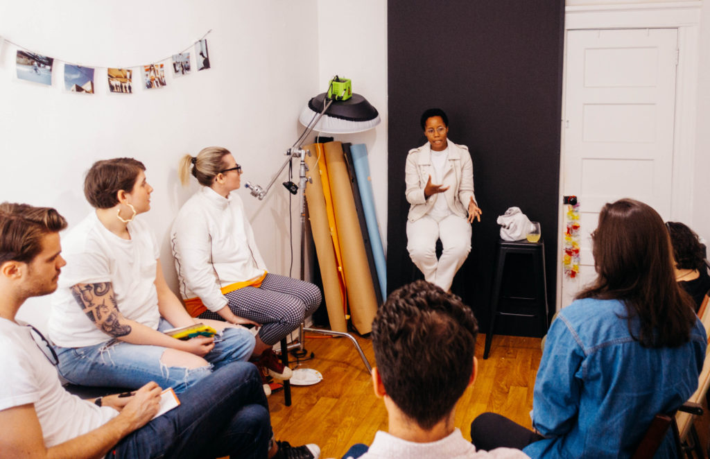 Photographer, Dana Scruggs, speaking to a group at The Love Wavelength Gathering